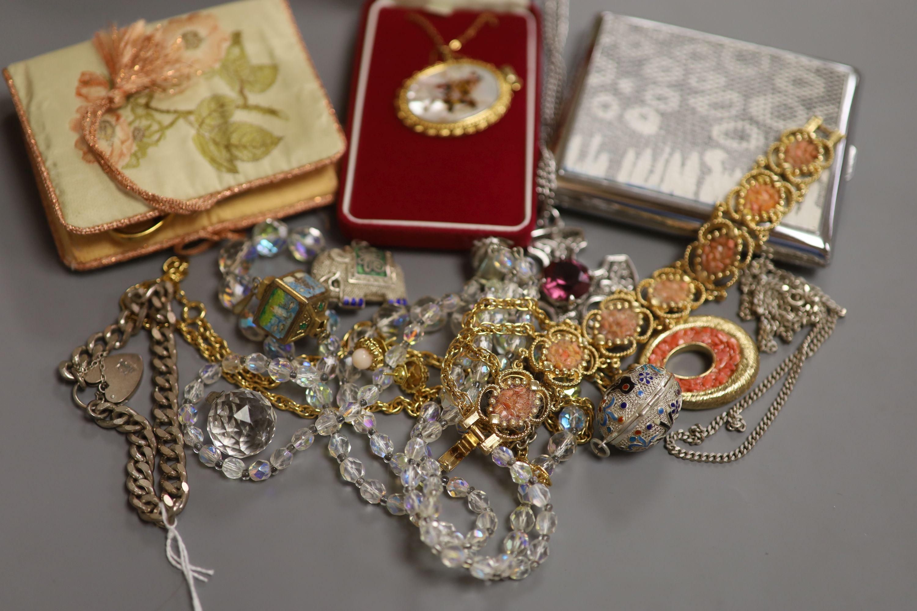 Mixed jewellery including silver bracelet, costume jewellery and a cigarette case.